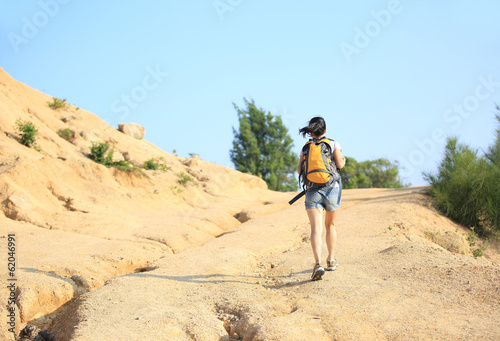  hiking woman walking on desert trail