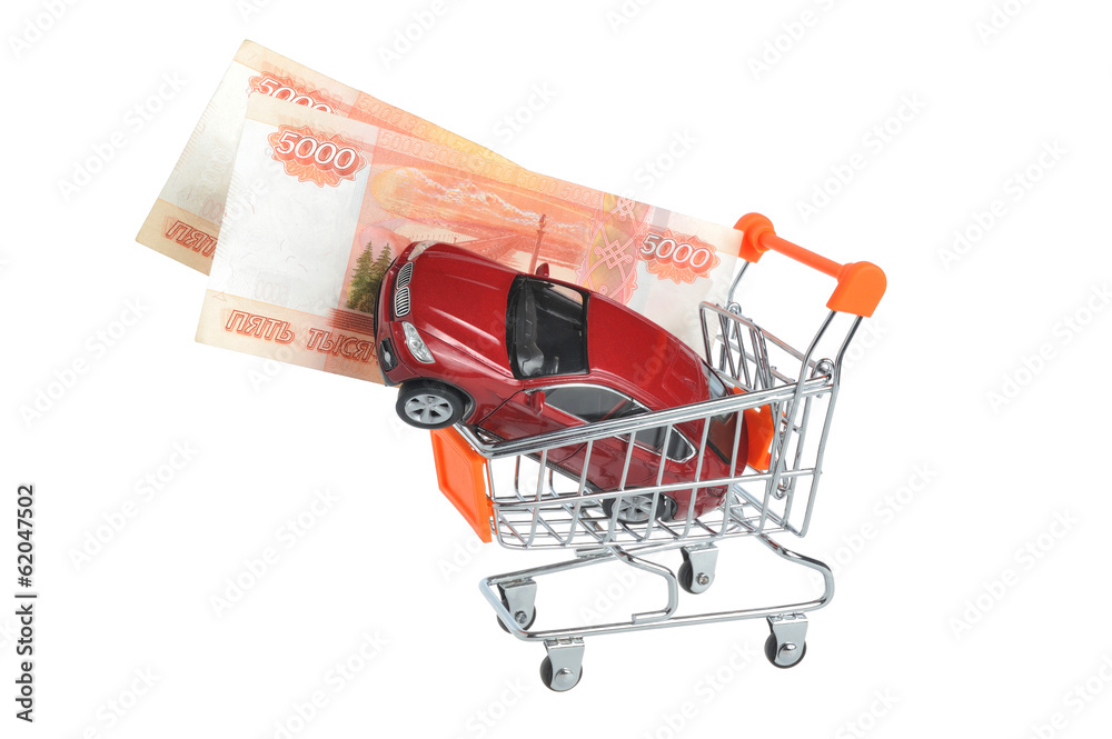 Toy car with money in shopping cart isolated on white