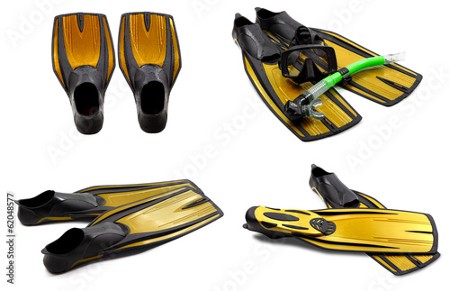 Set of yellow swim fins, mask, snorkel for diving with water dro