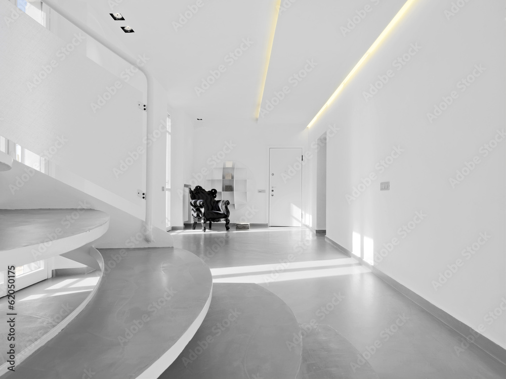 poltrona nera nel soggiorno moderno con scala poltrona nera nel soggiorno moderno con scala