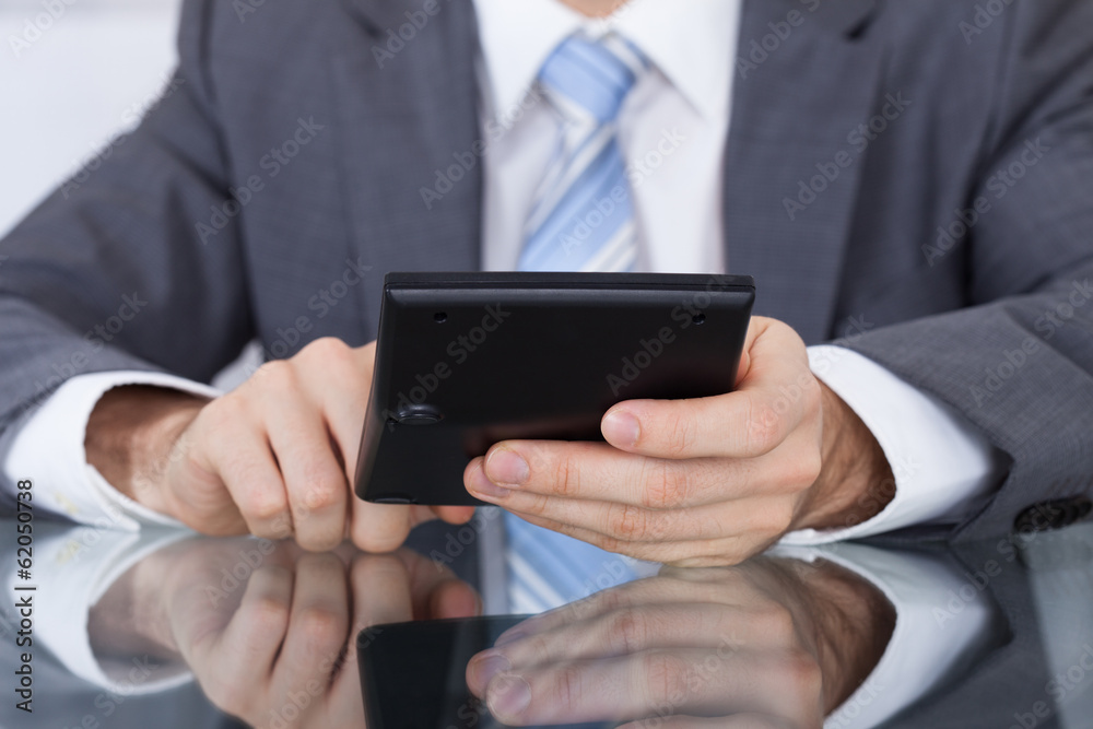 Businessman Working With A Calculator Businessman Working With A Calculator
