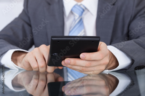 Businessman Working With A Calculator