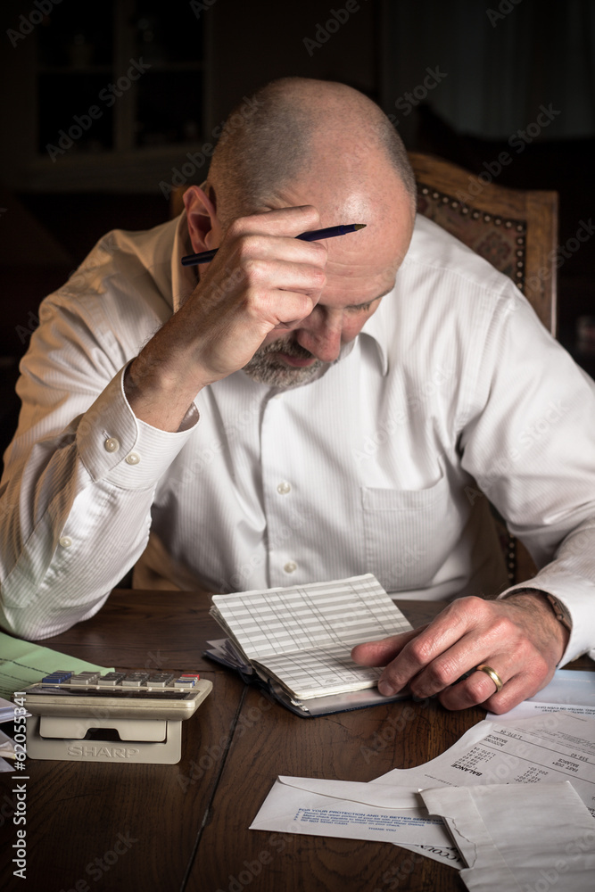 Man concentrating over finances Man concentrating over finances