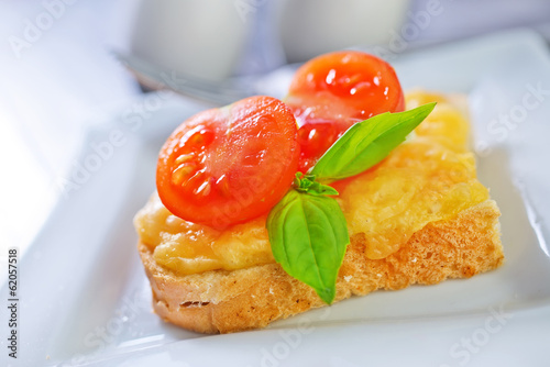 bread with cheese,tomato and basil photo