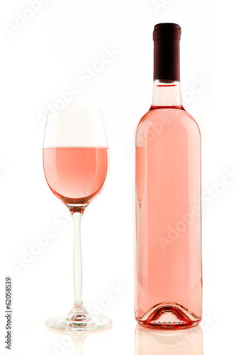 Bottle and glass of rose wine isolated