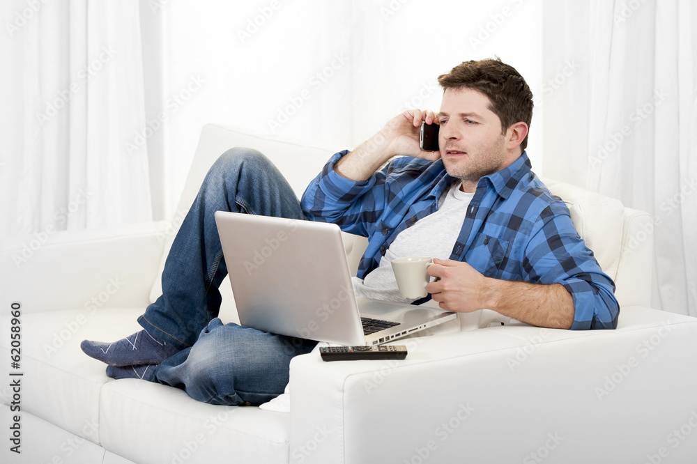 relaxed man with computer talking on mobile relaxed man with computer talking on mobile