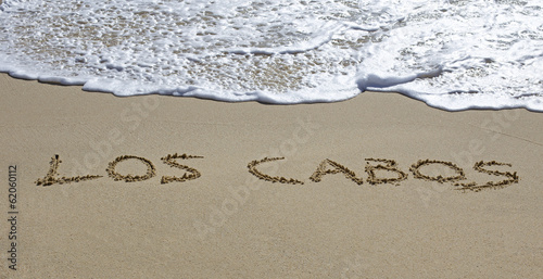 los cabos written on a wet beach photo