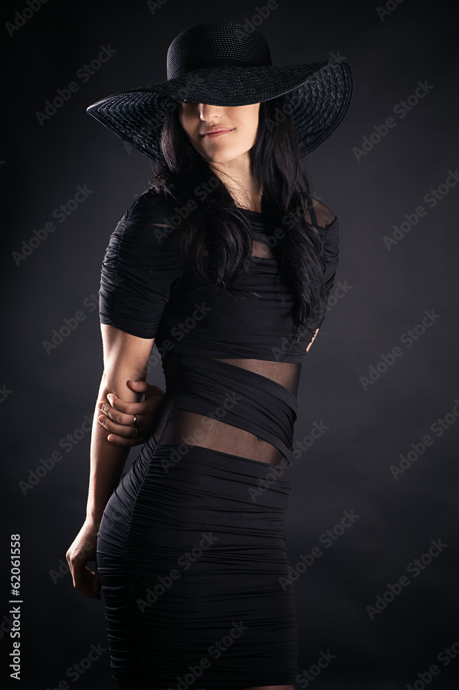 beautiful woman in a black dress and hat beautiful woman in a black dress and hat