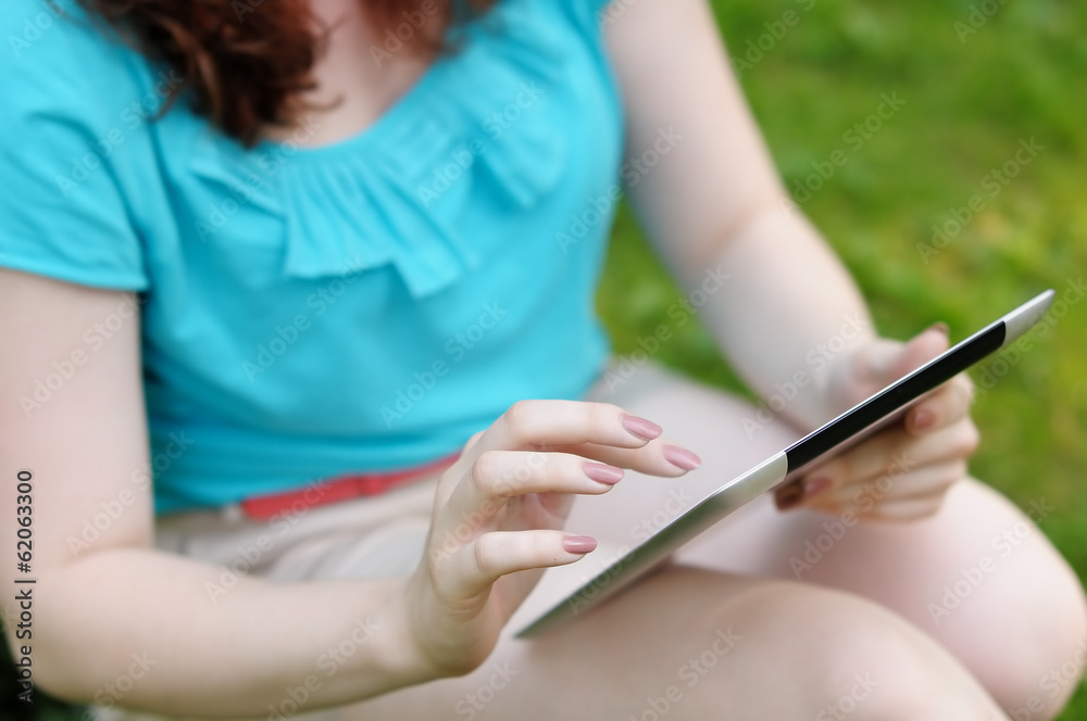 Young woman using tablet computer Young woman using tablet computer