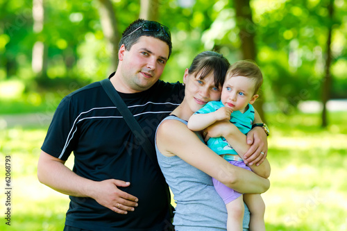 Happy family with a child hugging