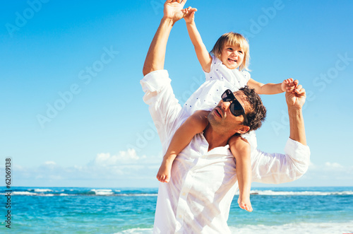 Father and daughter having fun together at the beach