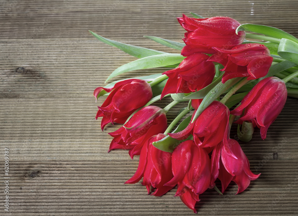 Bouquet of tulips on a wooden background