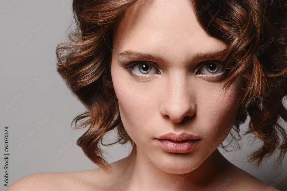 young beautiful girl with clean skin of the face. Pretty female young beautiful girl with clean skin of the face. Pretty female