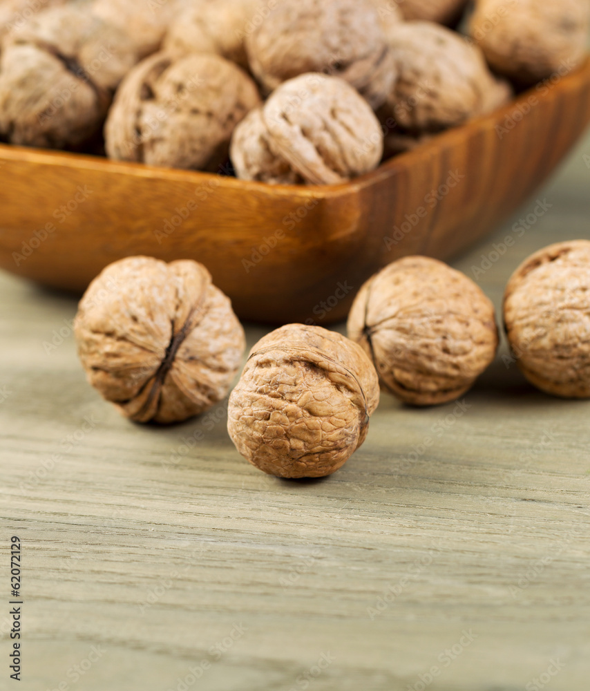 Whole Walnuts inside Shell on Faded Wood Whole Walnuts inside Shell on Faded Wood