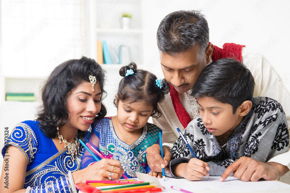 Indian family painting picture at home Indian family painting picture at home