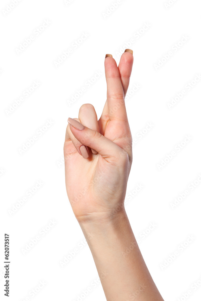 Crossed fingers symbolizing good luck isolated on white Crossed fingers symbolizing good luck isolated on white