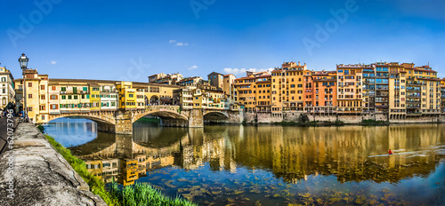 Ponte Vecchio with river Arno at sunset in Florence, Italy photo