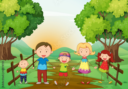 A happy family standing at the pathway