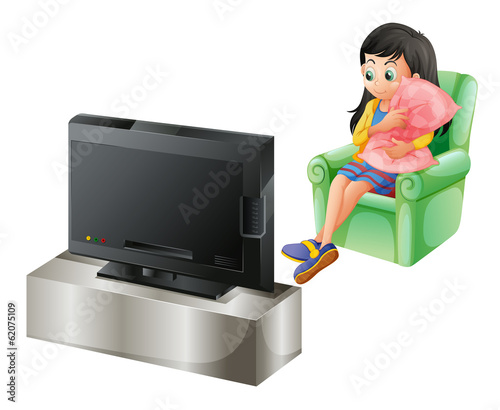 A young girl watching TV