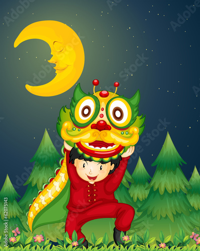 A young Chinese dancing with a dragon above his head