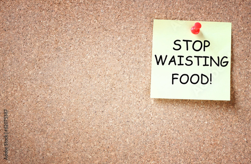 sticky note pinned with the phrase stop waisting food