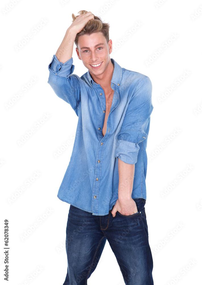 Happy young man with hand in hair Happy young man with hand in hair