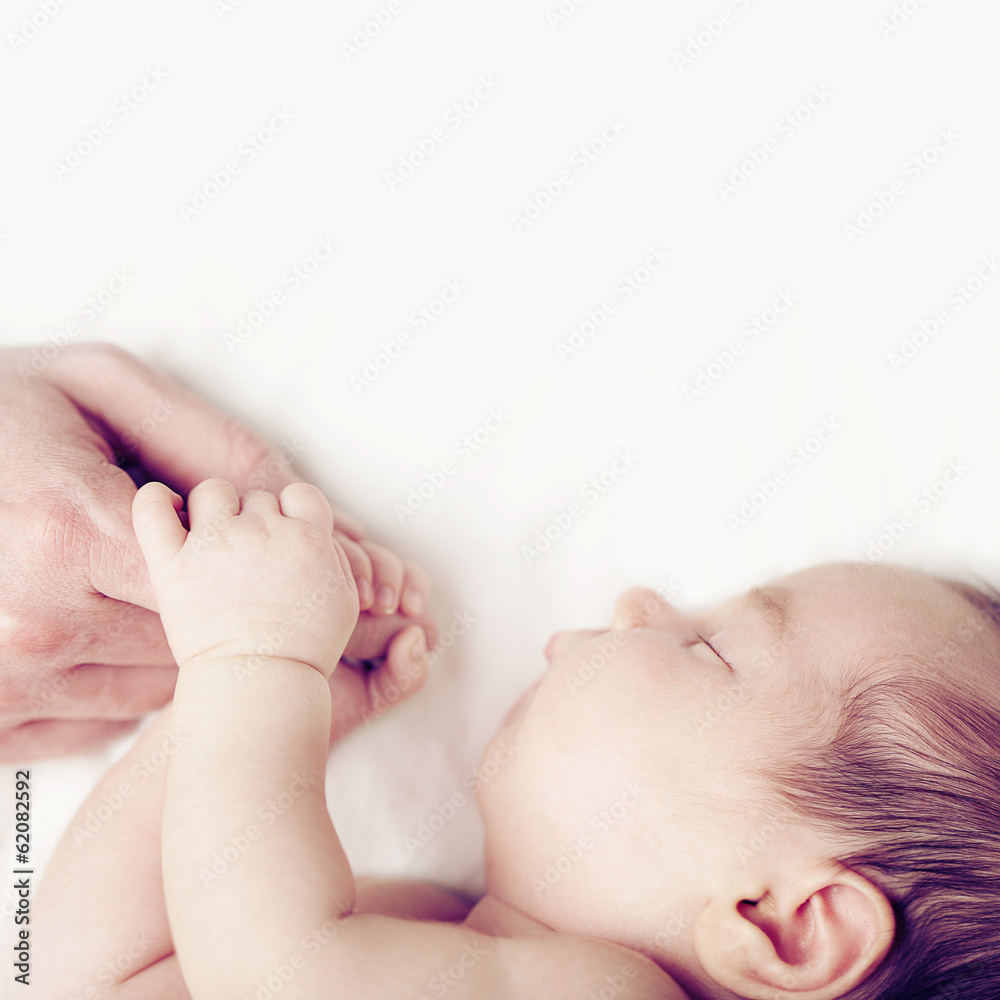 Baby and fathers hand, parental love Baby and fathers hand, parental love