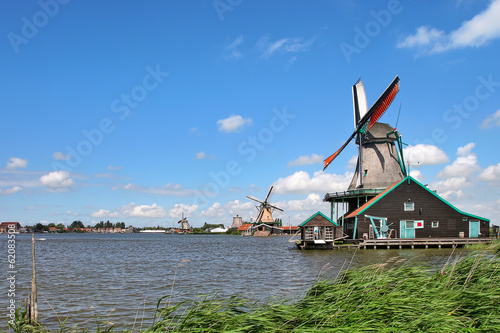 Wooden windmills in dutch village.