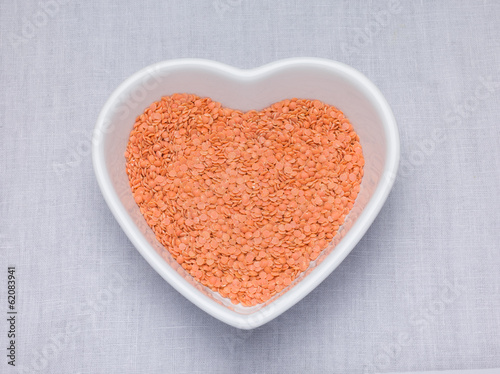 Red lentils, Petite crimson lentils in an heart shaped bowl