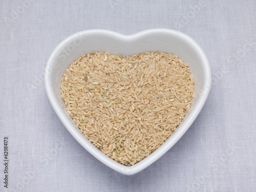 Brown rice in a heart shaped bowl