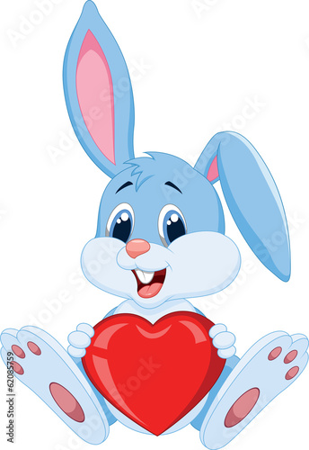 Cute rabbit holding red hat