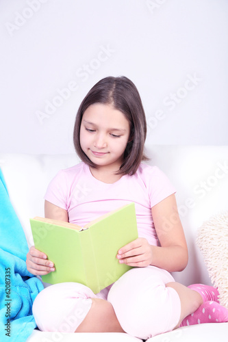 Beautiful little girl sitting