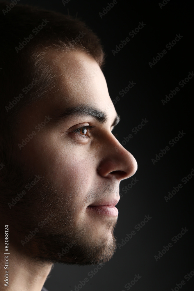 Handsome young man on dark background Handsome young man on dark background
