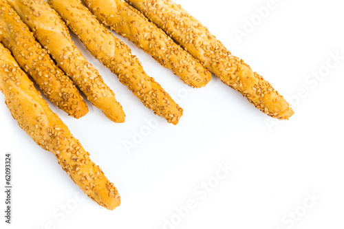 Sesame breadsticks on white background