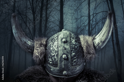 Fototapeta Helmet, Viking warrior, male dressed in Barbarian style with swo