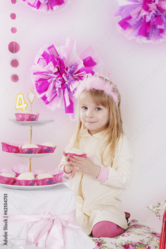 Girl with piece of cake at pink decoration birthday party Girl with piece of cake at pink decoration birthday party