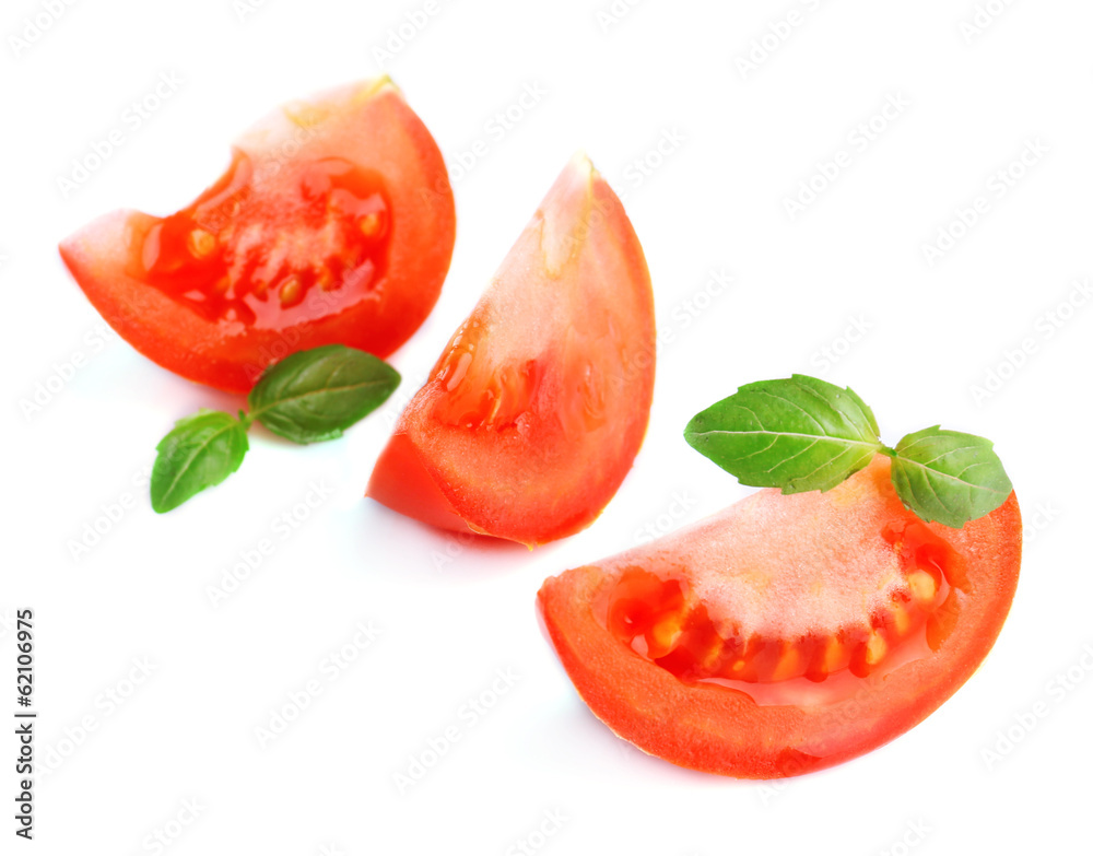 Slices of fresh tomato with basil, isolated on white Slices of fresh tomato with basil, isolated on white