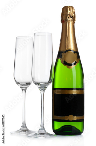Bottle of champagne and empty glasses  isolated on white