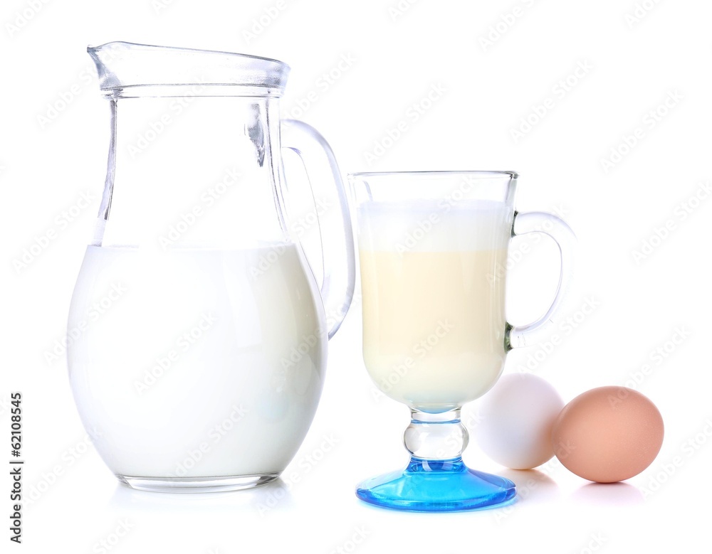Eggnog with milk and eggs isolated on white Eggnog with milk and eggs isolated on white
