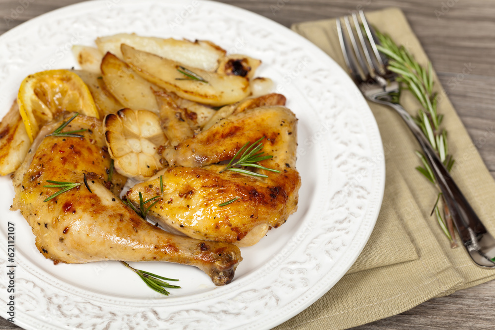 Roasted Chicken with Rosemary with potato. Selective focus.