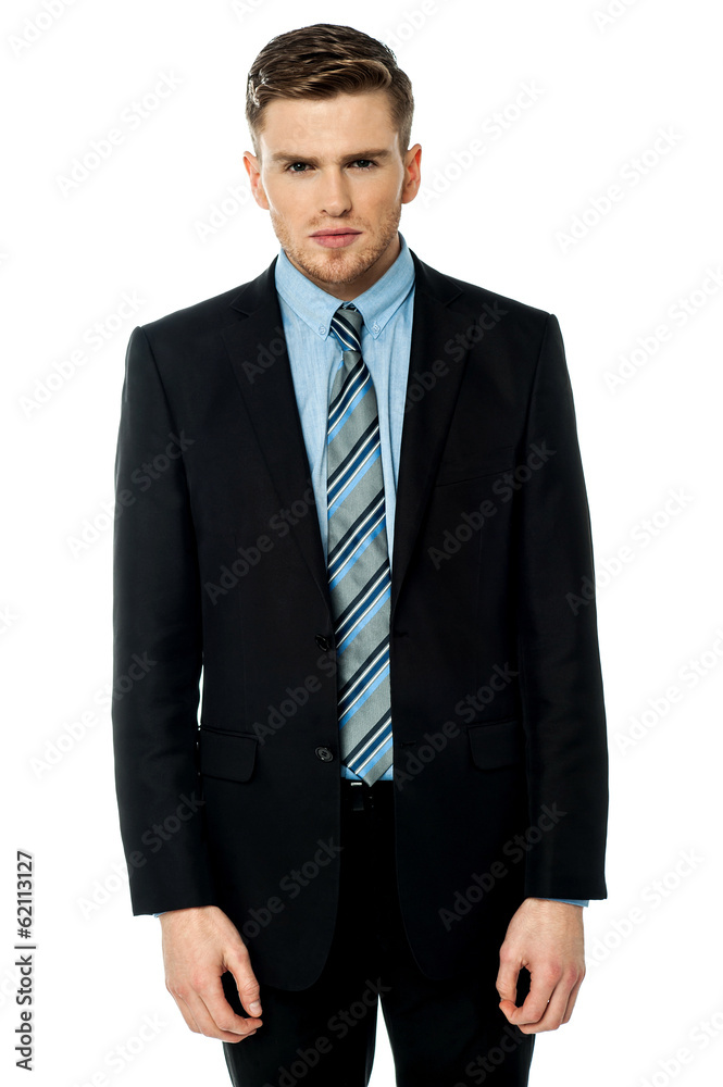 Smart male business executive posing to camera Smart male business executive posing to camera
