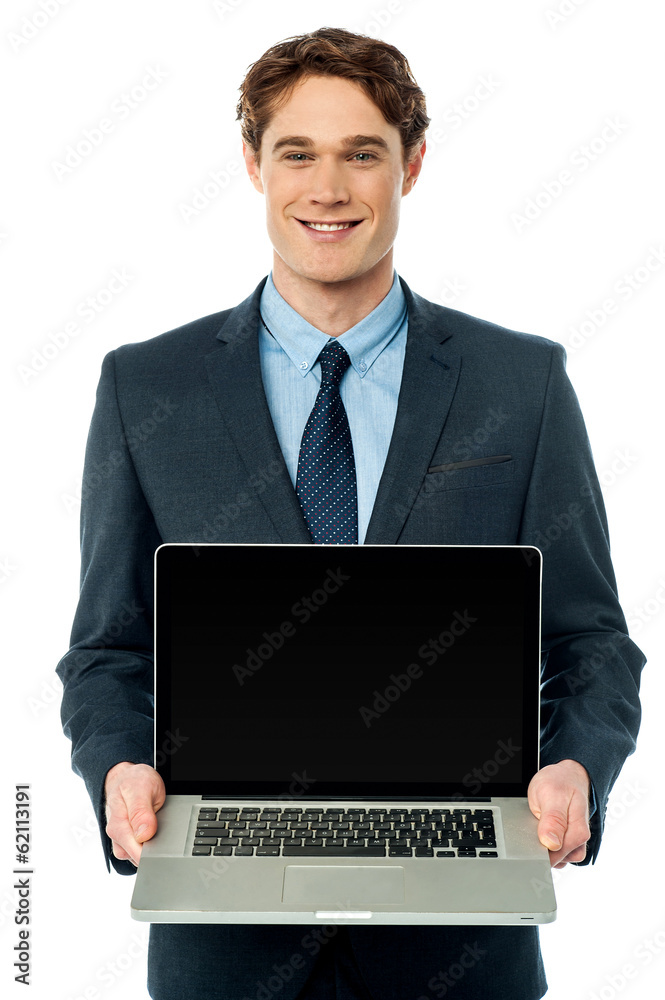 Corporate executive showing laptop to camera Corporate executive showing laptop to camera