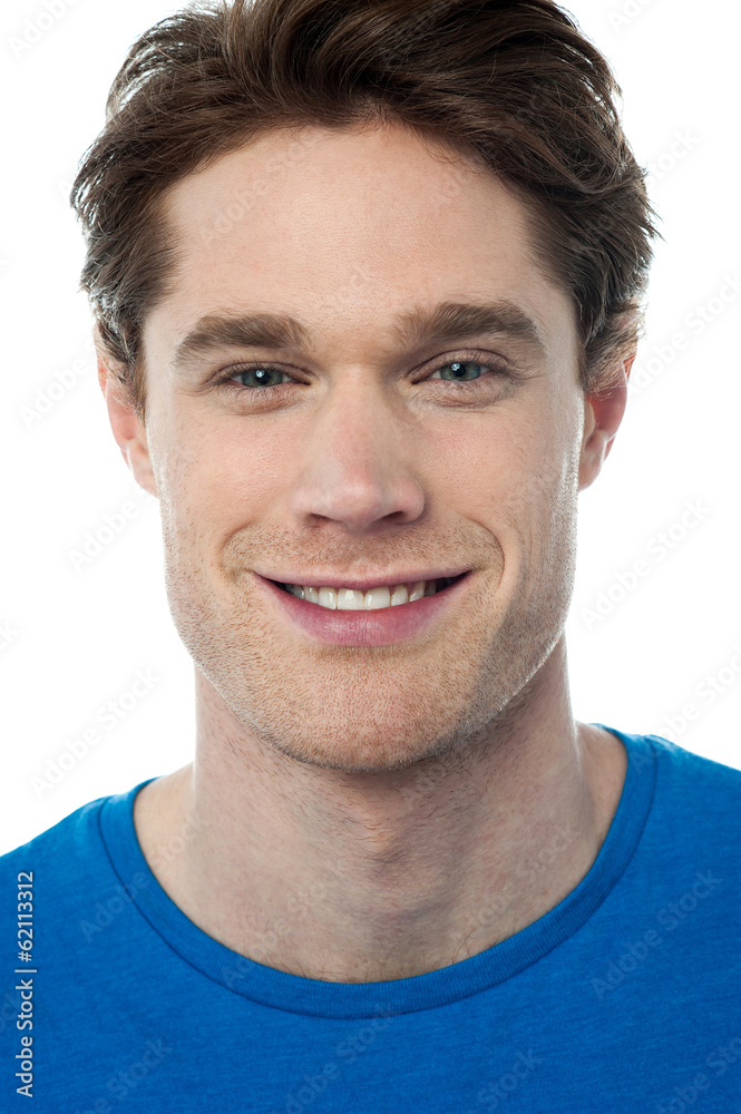 Fototapeta premium Smiling handsome guy isolated over white