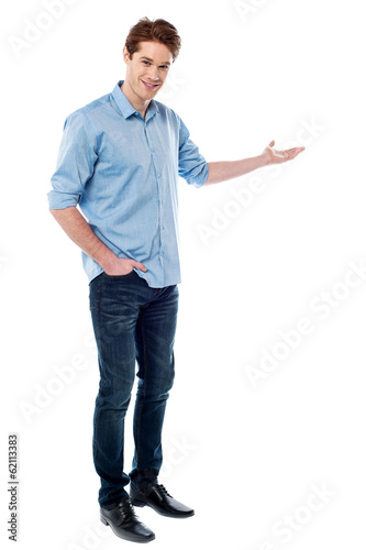 Young man welcoming guests