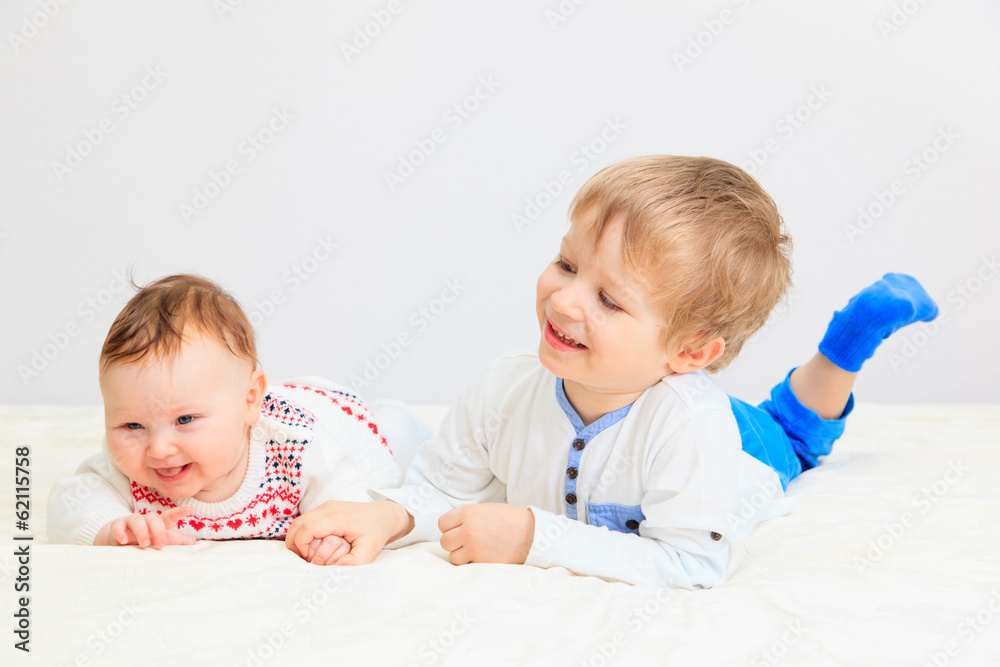 portrait of little boy with newborn sister portrait of little boy with newborn sister