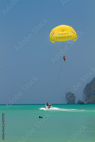 Fototapeta Naklejka Na Ścianę i Meble -  Parachute surfer being hauled by a motorboat in Thailand