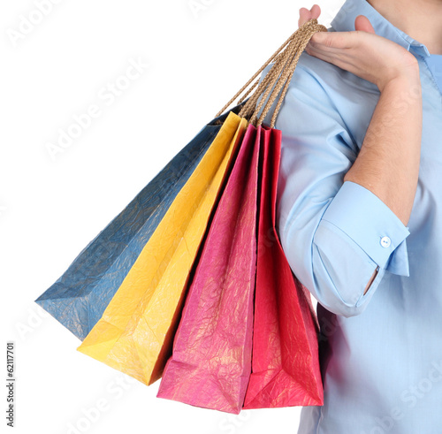 Young woman holding colorful shopping bags in her hand,
