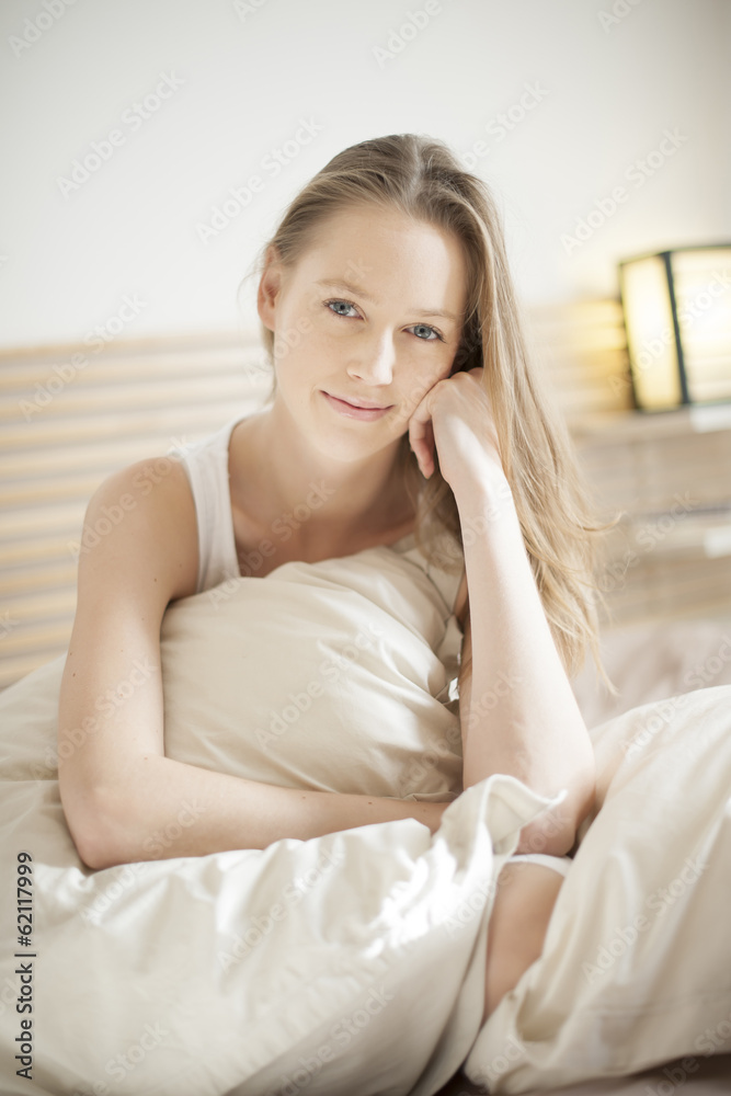 portrait of a beautiful young woman in her bedroom portrait of a beautiful young woman in her bedroom