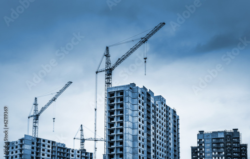 Tower cranes and modern buildings under construction