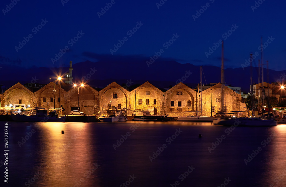 Old venetian arsenal at port Chania in Crete, Greece.